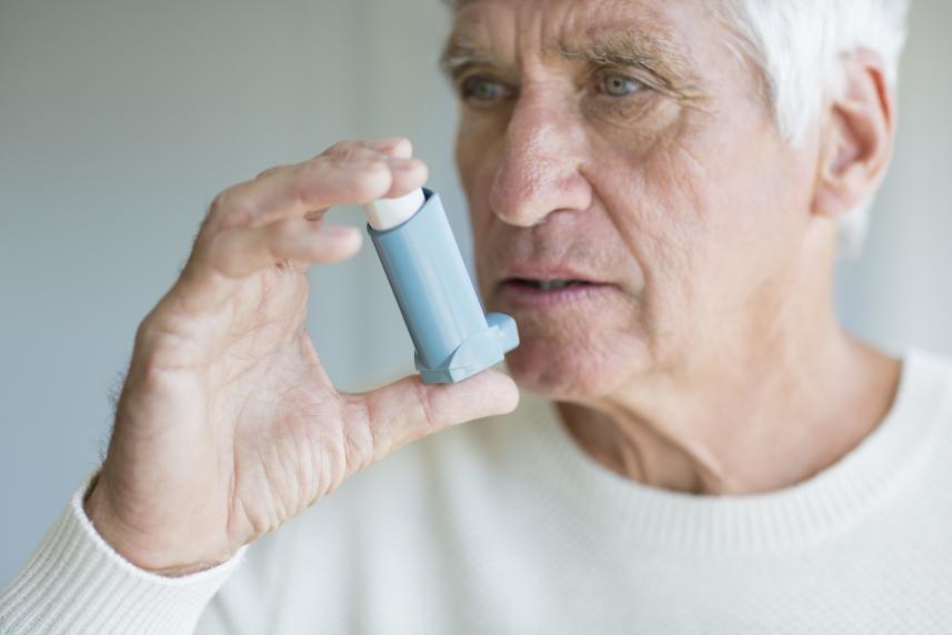 Man using inhaler 