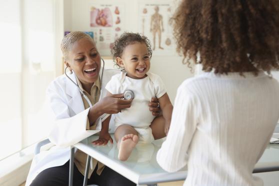 Happy baby at a pediatrician visit